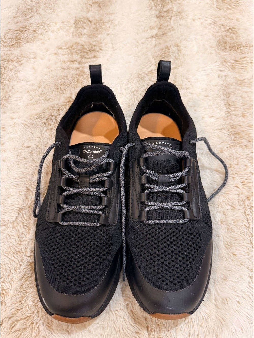 Black lace-up athletic shoes